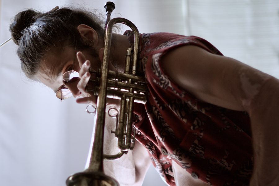 Jamen Krause with trumpet, close portrait.
